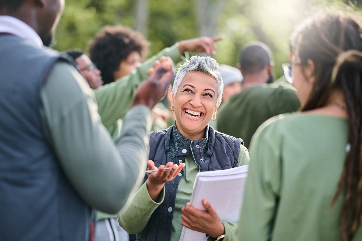 Woman smiling and listening to others