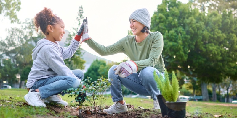 Young and older person clapping hands